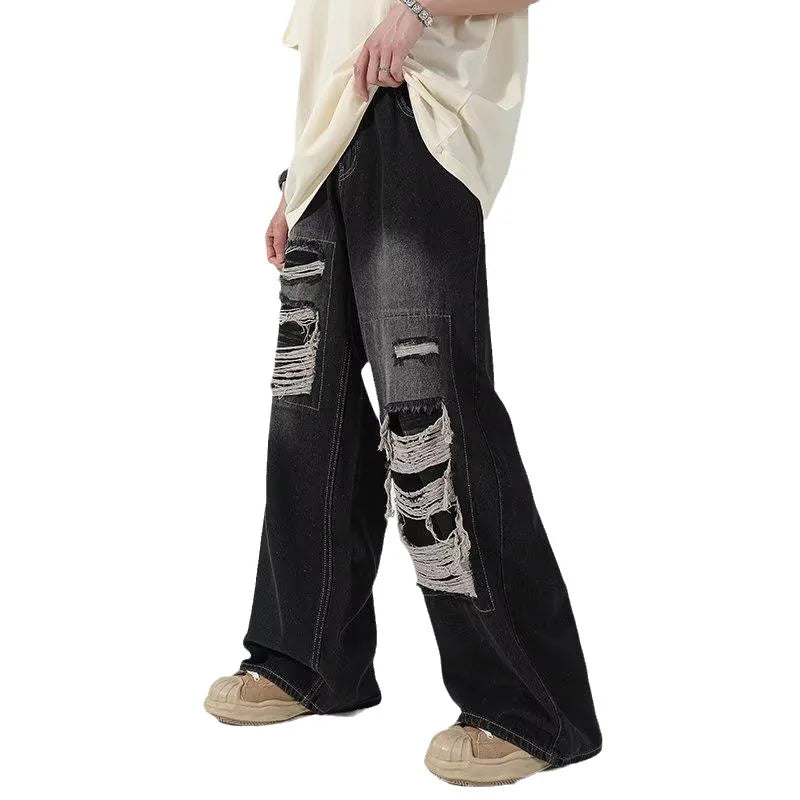 Wide-leg distressed denim jeans
